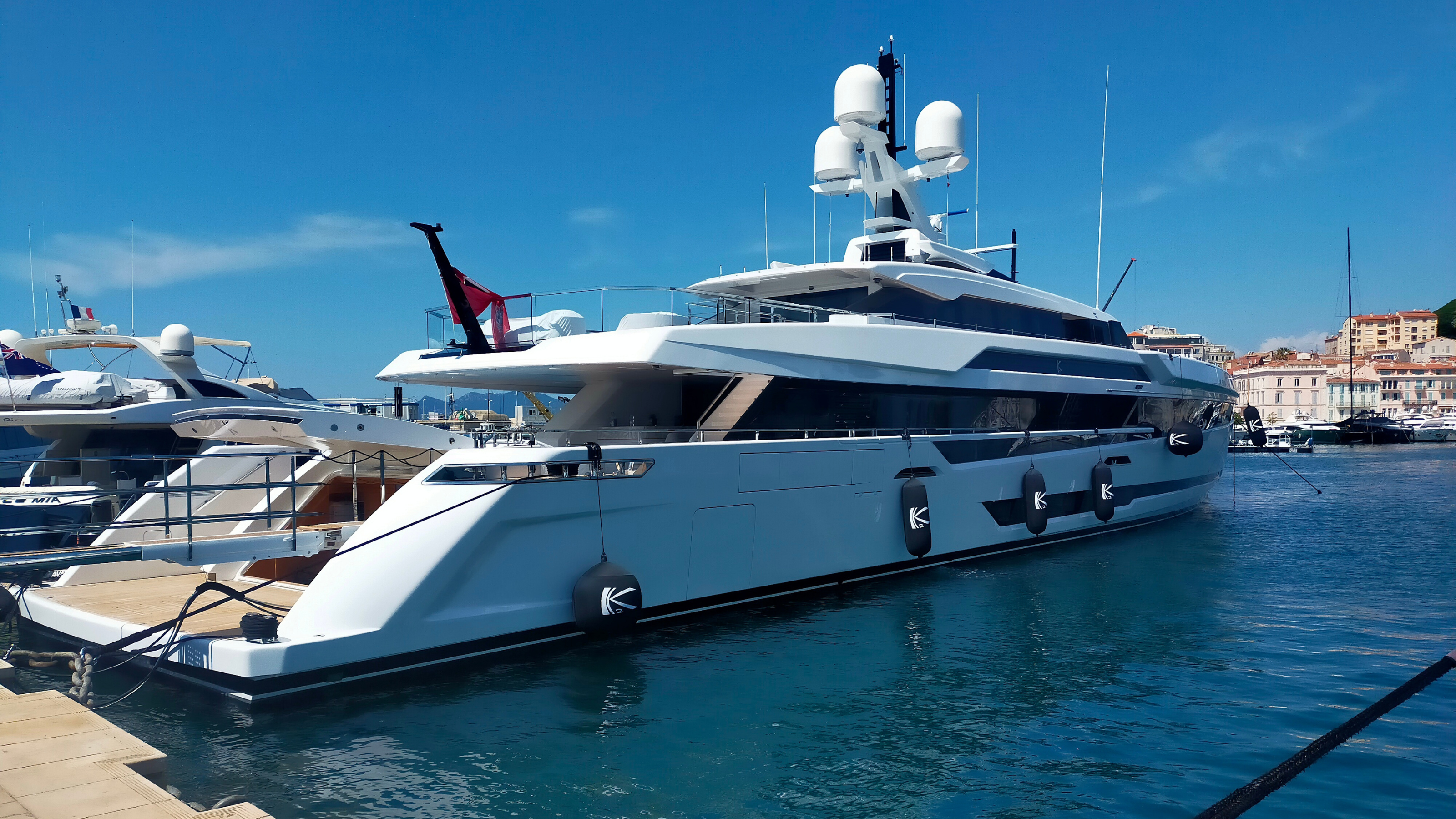 Superyacht docked in marina equiped with fendertex inflatable textile bumper fenders